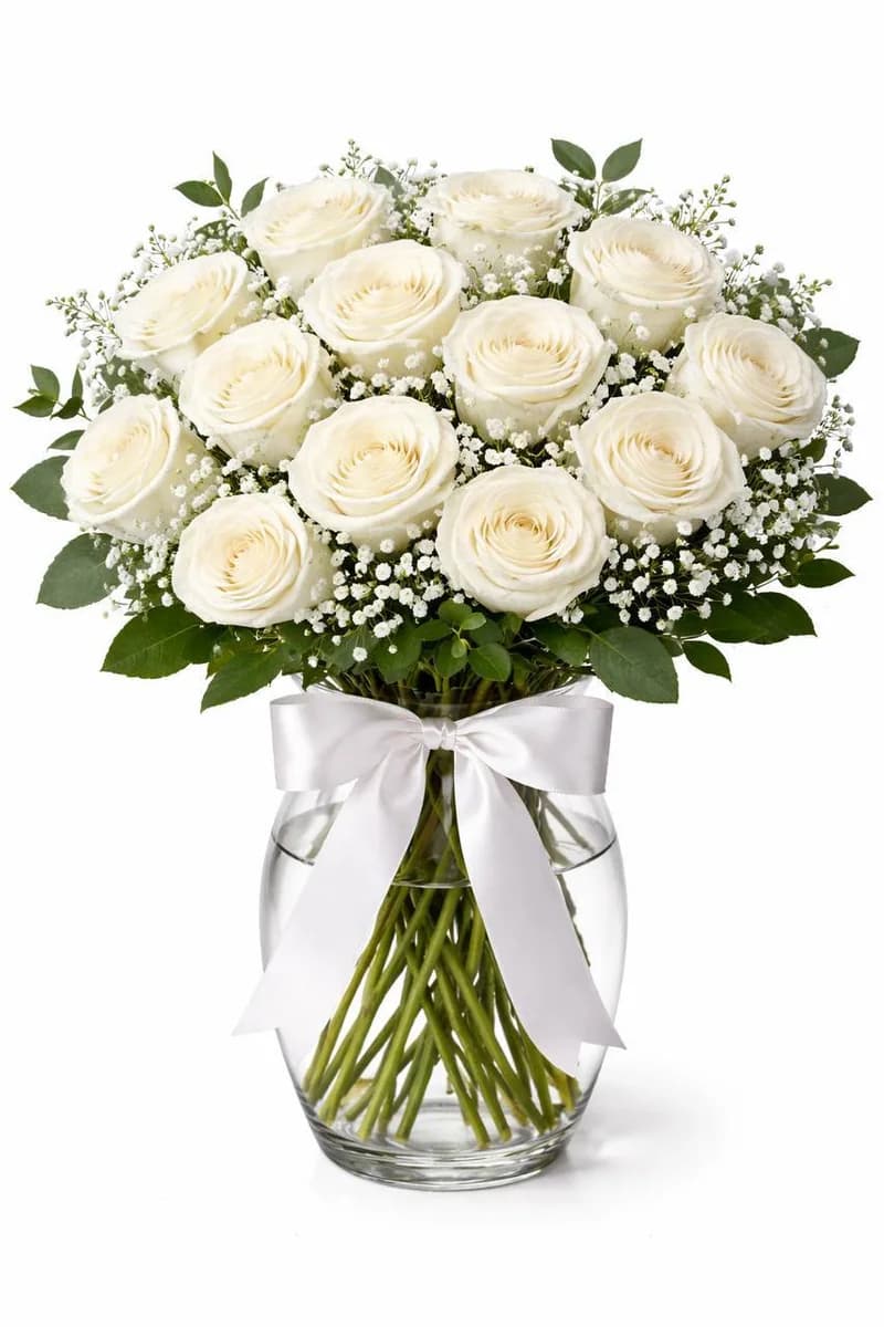 Dozen white roses in a glass vase with white ribbon by Bana Florist Toronto