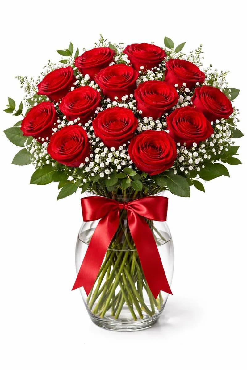 Dozen red roses in a glass vase with red ribbon by Bana Florist Toronto